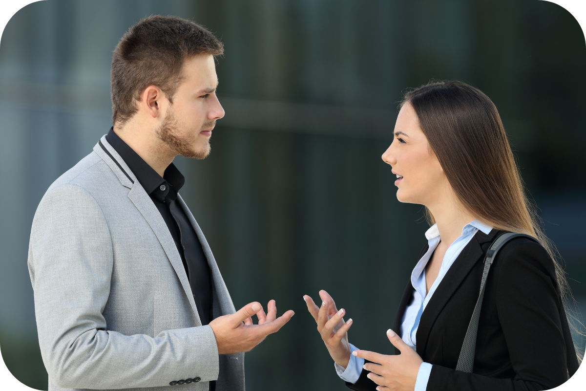man and woman engaged in a difficult conversation